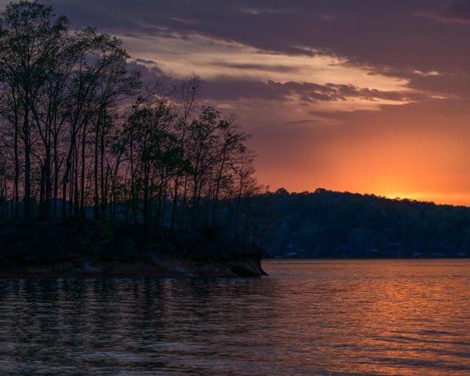 While I love wide angle landscape photos, I am beginning to see the different stories I can tell with the telephoto. Here is the same sunset on Lake Hartwell from , as Obi-Wan would say, "a different point of view."
